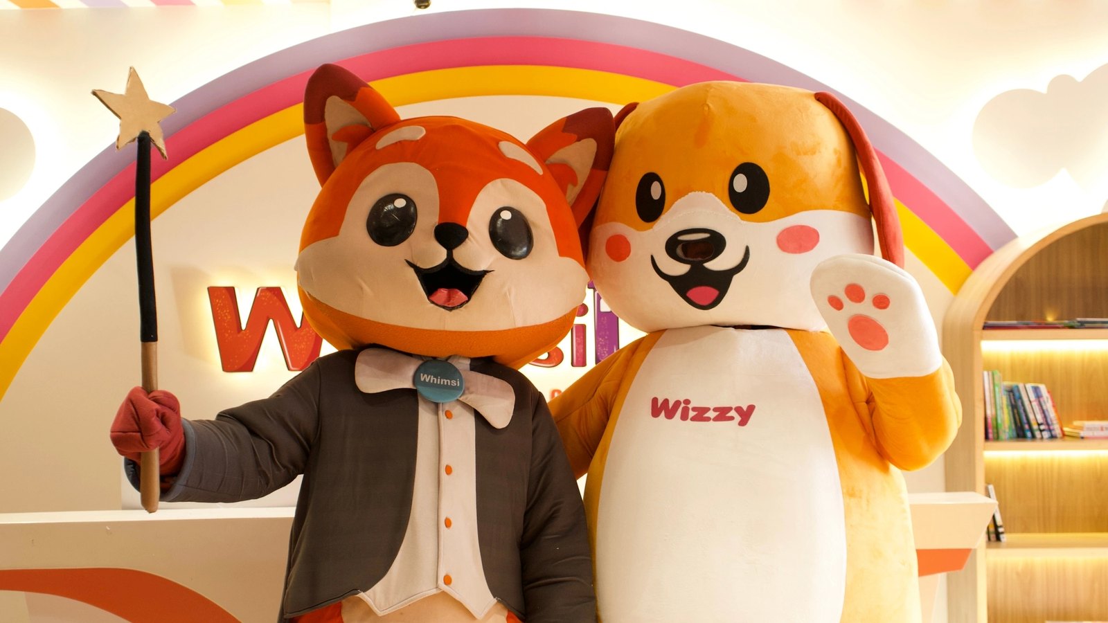 Whimsi and Wizzy, the WhimsiLand mascots, at the reception rainbow